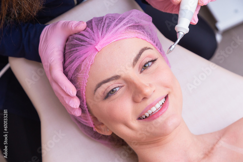 closeup photo of woman's face, photo of aesthetics, anti aging procedures. Plasma jet application. Aesthetics, spa. beautician. photo
