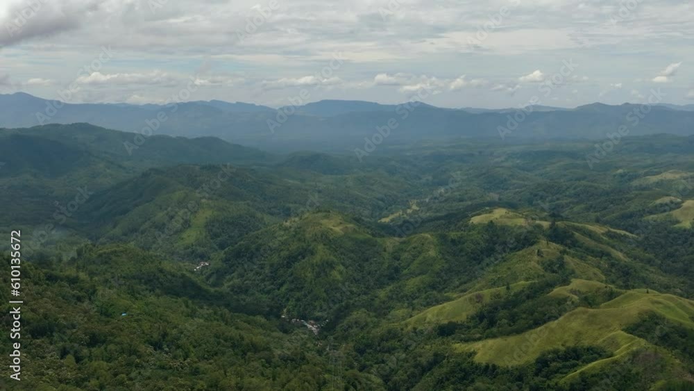 Top view of mountain slopes covered with rainforest and jungle. Sumatra, Indonesia. Top view of mountain slopes covered with rainforest and jungle. Sumatra, Indonesia.