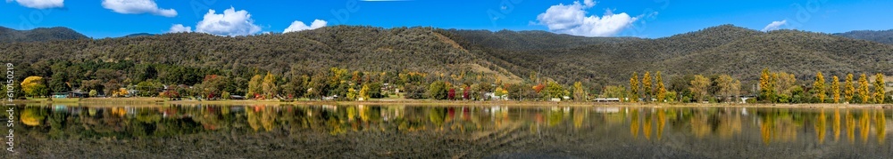 Panoramic shot of beautiful Pondage and reflections at Mount Beauty, Victoria, Australia in autumn. The Mount Beauty Regulating Pondage is part of the Kiewa Hydroelectric Scheme and popular travel des