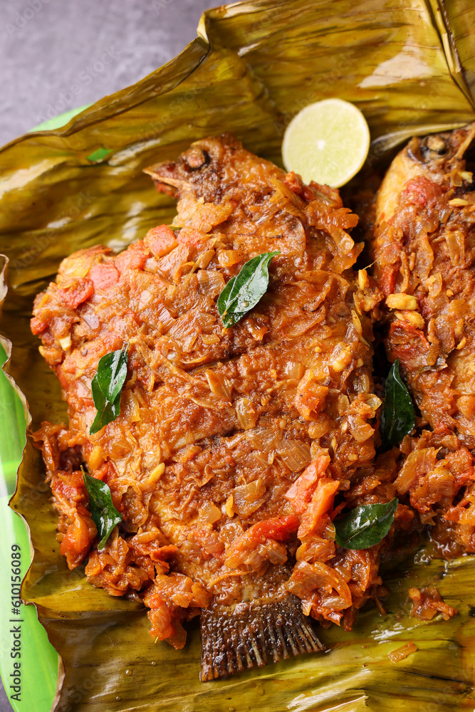 Kerala fish curry Karimeen Pollichathu a popular hot and spicy baked