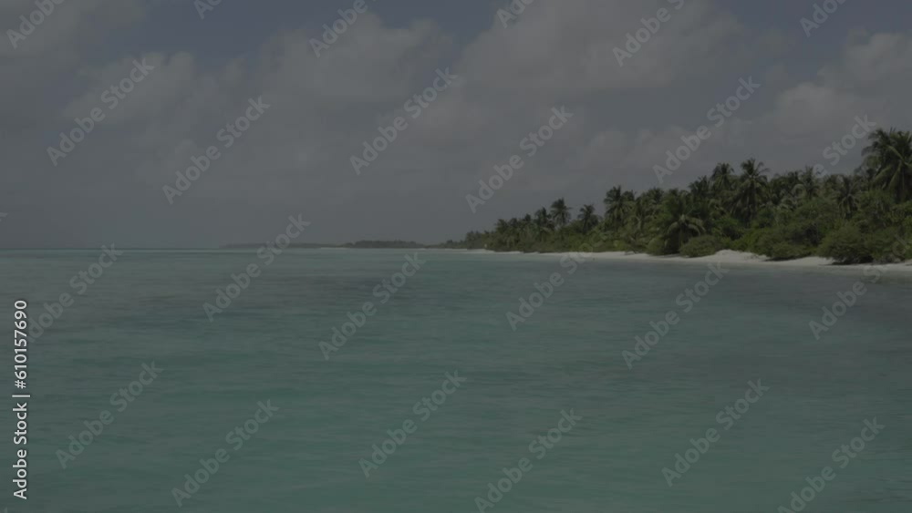 A beautiful bird's eye view of tropical islands in the Maldives. Aerial photography of exotic tropical islands. Footage without color correction. A beautiful bird's eye view of tropical islands in the Maldives. Aerial photography of exotic tropical islands. Footage without color correction.