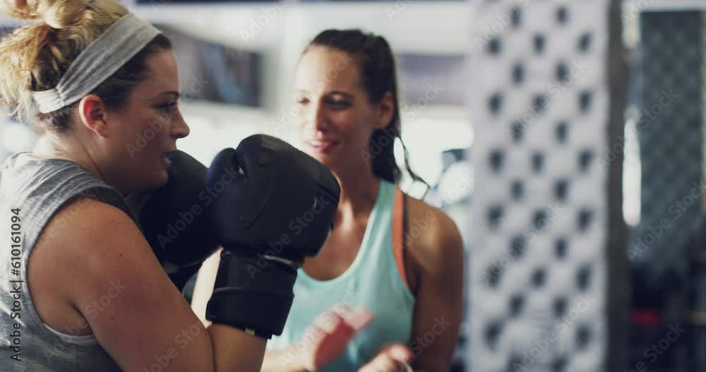 Personal trainer, coaching and boxing with woman in gym for training, workout and weight loss challenge. Performance, energy and power with girl in fitness center for fight, wellness and martial arts Personal trainer, coaching and boxing with woman in gym for training, workout and weight loss challenge. Performance, energy and power with girl in fitness center for fight, wellness and martial arts