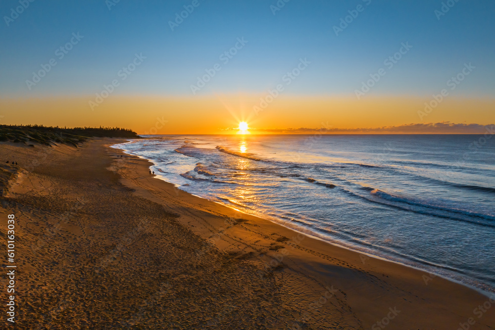 Aerial sunrise seascape with clear skies