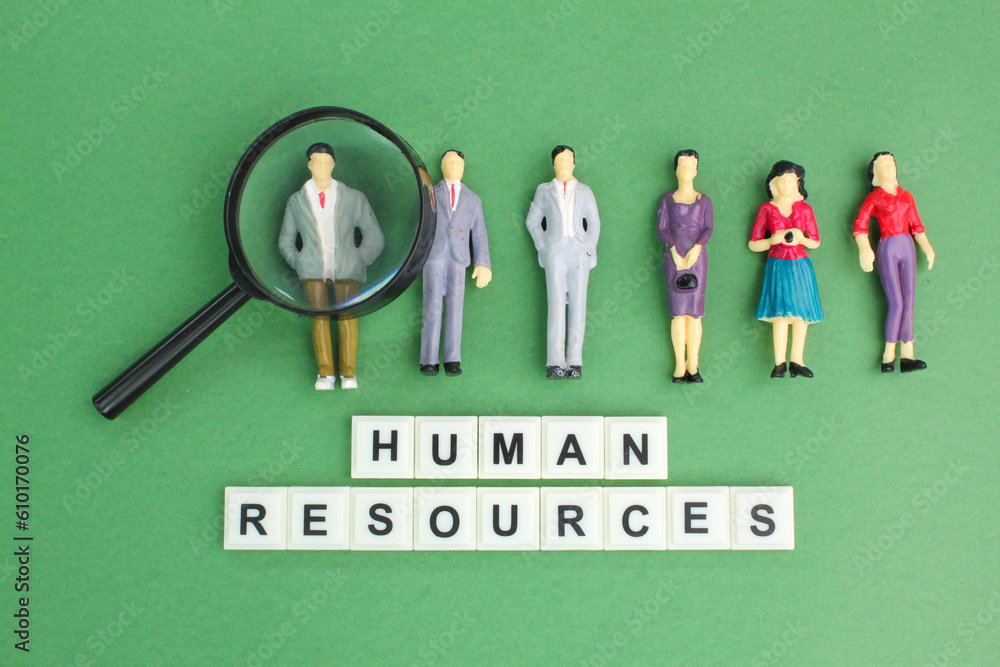 magnifying glass and miniature people with the word Human resource. the concept of human resources magnifying glass and miniature people with the word Human resource. the concept of human resources