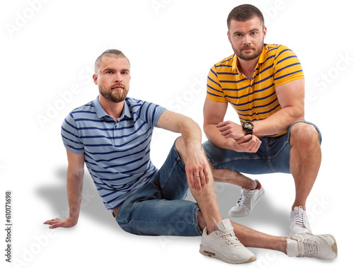 Two cheerful young men sitings photo