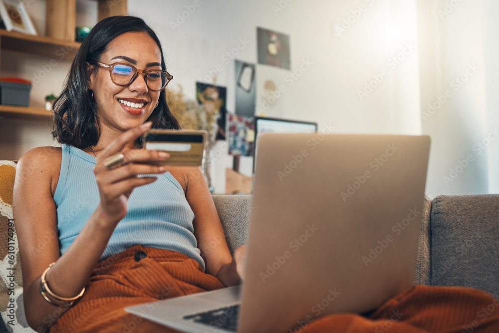 Woman on couch with laptop, credit card and online shopping, payment and ecommerce with fintech at home. Happy female customer at apartment, bank app and sale on store website with internet banking - obrazy, fototapety, plakaty 