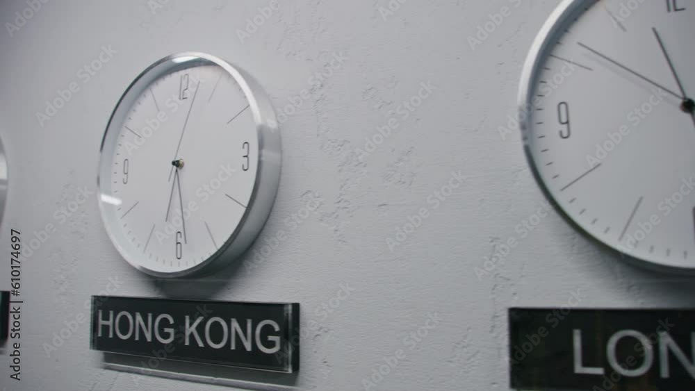 White watches with running time pointers show time zones of different