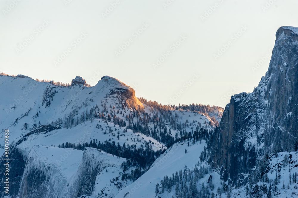 Early sunlight catching the snowcapped mountain tops of the Sierra Nevadas in Yosemite National Park.