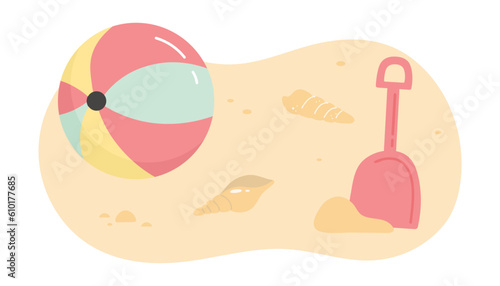 Beach ball and shovel on the sand with shells