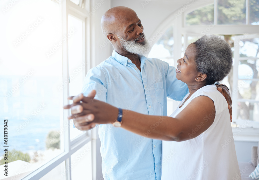 Fototapeta premium Black couple, dancing and together in senior home with love, care and commitment. Happy african man and woman relax and dance to enjoy marriage, retirement and happiness while holding hands