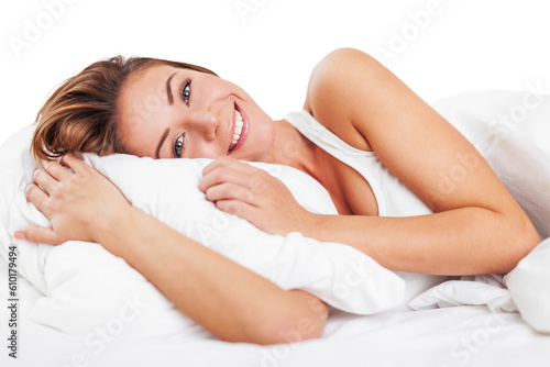 Foto Young woman wakeup after sleeping on the white linen in bed at home