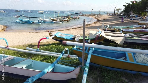Wallpaper Mural Colorful Boats and Canoes Docked in White Sand Beach Blue Sea and Skyline Tropical Destination of Sanur Bali Indonesia Torontodigital.ca