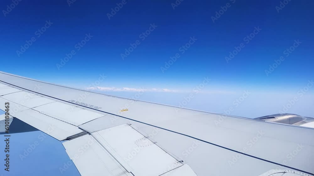 flight window view in air with bright blue sky at day video taken at vistara flight from delhi to guwahati in india on Mar 05 2022. flight window view in air with bright blue sky at day video taken at vistara flight from delhi to guwahati in india on Mar 05 2022.