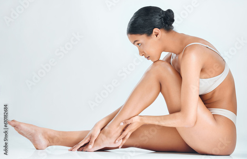 Woman profile  smooth skin and legs epilation of wellness  cosmetic wax and skincare treatment in studio. White background  female model and natural beauty with body care and leg shave in underwear