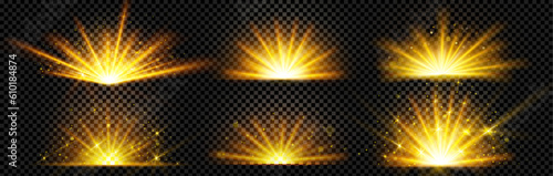 Realistic set of golden light shine isolated on transparent background. Vector illustration of yellow flash with shimmering glitter particles. Magic energy, explosion bokeh effect, sunshine rays