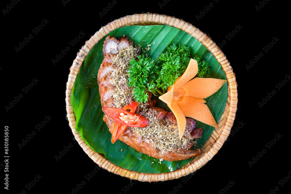 Fototapeta premium Braised pork belly with lemongrass isolated on black background