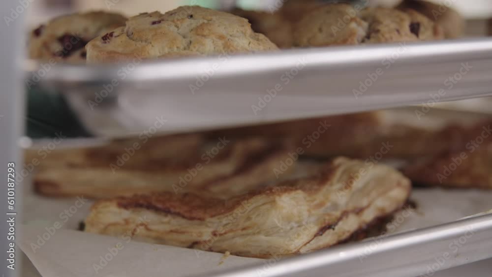 Close up of a fresh pastry on a cooling rack before being put into display cases. Close up of a fresh pastry on a cooling rack before being put into display cases.
