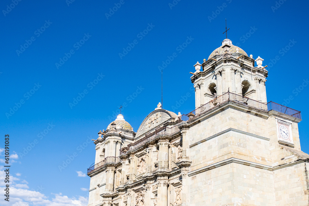 Fototapeta premium Colonial cathedral in Oaxaca, Mexico, against bright blue sky.