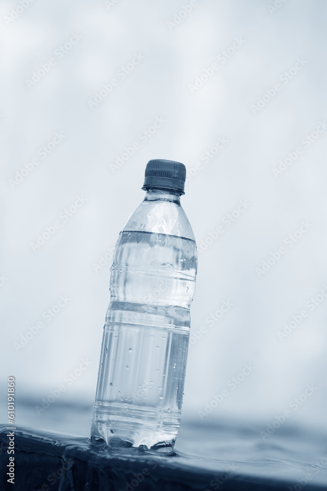 bottle of water near fountain bottle of water near fountain