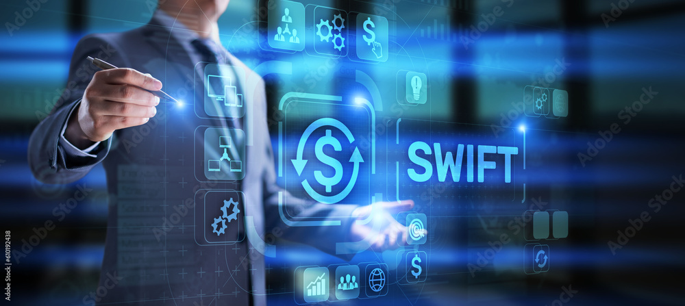 SWIFT Society for Worldwide Interbank Financial Telecommunications money transfer banking technology concept. SWIFT Society for Worldwide Interbank Financial Telecommunications money transfer banking technology concept.