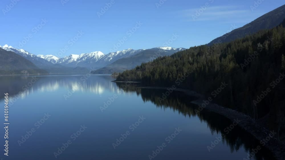 Elevated Bliss: Overlooking Slocan Lake's Sparkling Blue Beauty Encircled by Snowy Forested Peaks Elevated Bliss: Overlooking Slocan Lake's Sparkling Blue Beauty Encircled by Snowy Forested Peaks