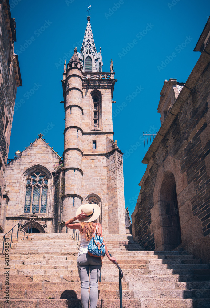 Fototapeta premium Woman is walking in the old town Morlaix- France
