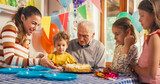 Portrait of a Small Family Gathering Around a Cake at a Birthday Party. Young Mother Cutting and Serving the Cake on Separate Plates. Happy Shared Moments and Memories Between Family Members 
