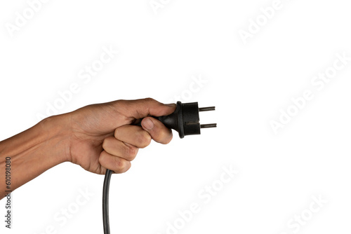 Black male hand holding an electric power plug isolated