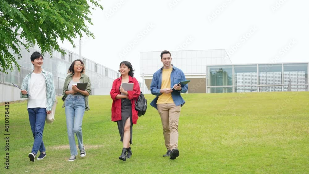 Multinational youth group walking in outdoor facility. Multinational youth group walking in outdoor facility.