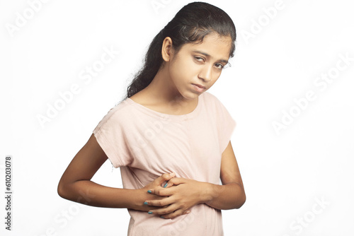 slim teenage girl having liver disease causes pain in the gall bladder