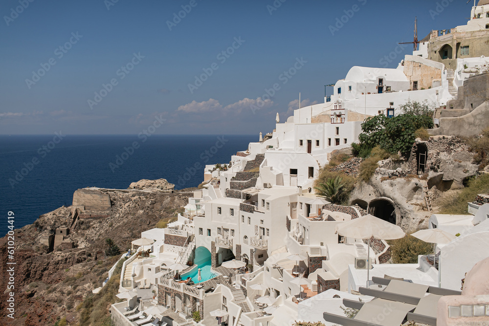 Picturesque view of Santorini, Oia, Greece. Medieval historic blue and white buildings and seaside view. Traditional European, Greek architecture. Summer holidays travel