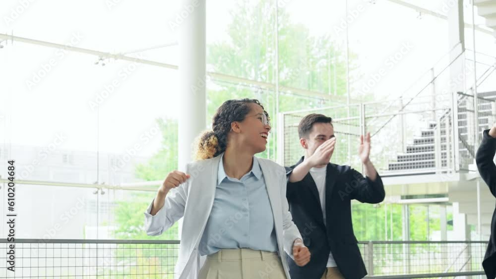 Multinational business group dancing in lobby. Success of business. Multinational business group dancing in lobby. Success of business.