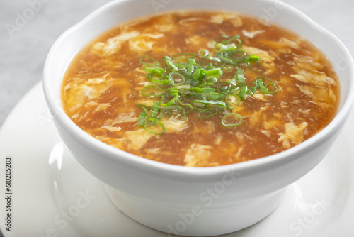 A view of a bowl of hot and sour soup.