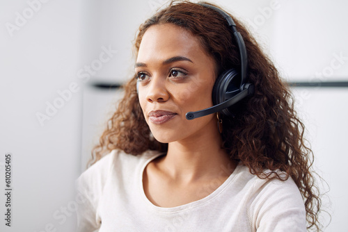 Call center, woman and face of consultant at computer for customer service, technical support and CRM. Female telemarketing agent at desktop for communication, telecom consulting and sales help desk