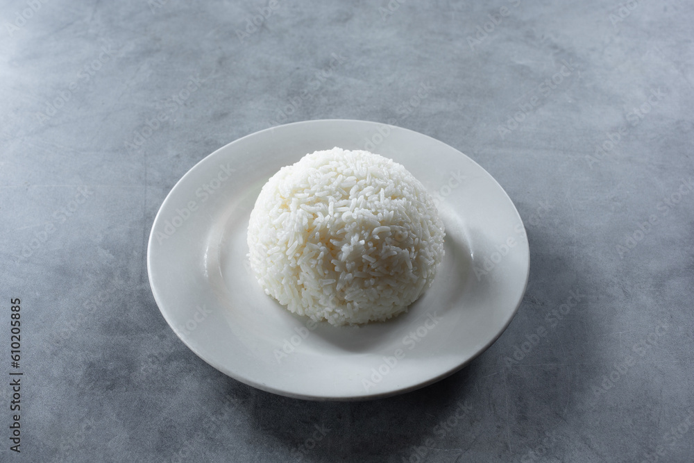 A view of a plate of steamed white rice. A view of a plate of steamed white rice.