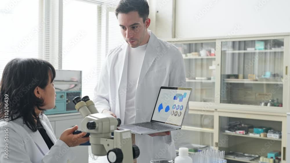 Multinational researcher group experimenting in the lab. Research and Development. Multinational researcher group experimenting in the lab. Research and Development.