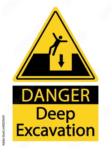 Danger, deep excavation. Warning yellow triangle sign with a  silhouette of person falling and text below.