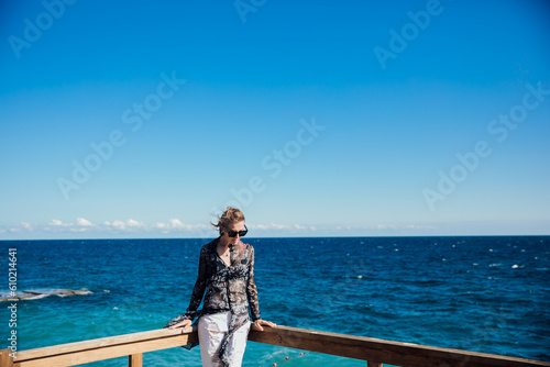 a woman on a walk by the sea voyage