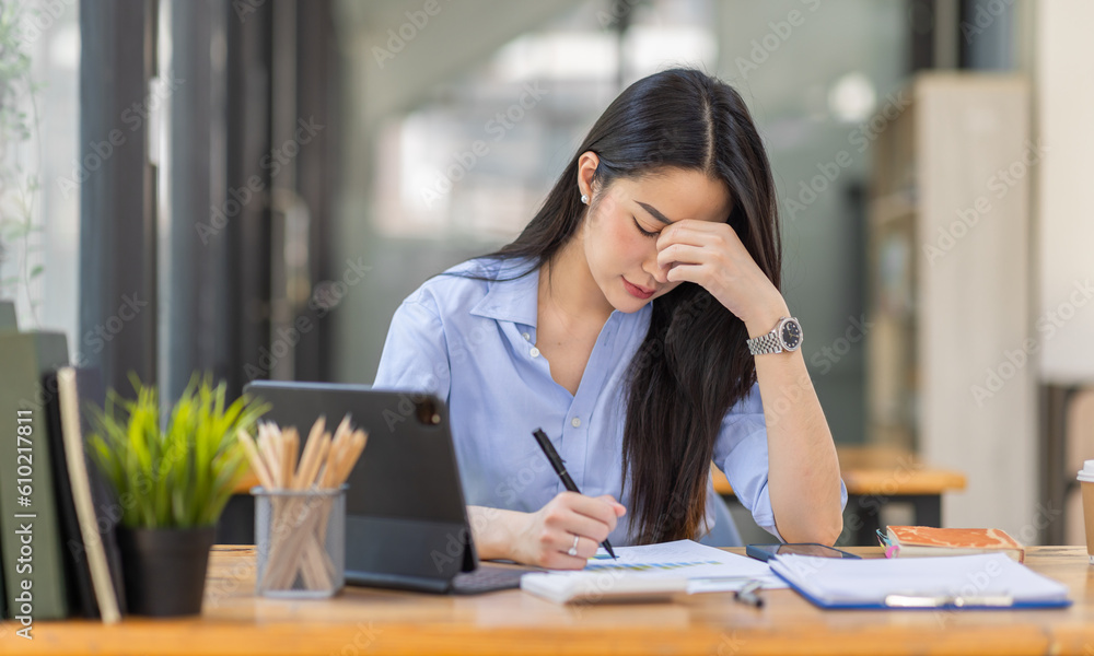 Portrait of tired young business Asian woman work with documents tax laptop computer in office. Sad, unhappy, Worried, Depression, or employee life stress concept
Portrait of tired young business Asian woman work with documents tax laptop computer in office. Sad, unhappy, Worried, Depression, or employee life stress concept