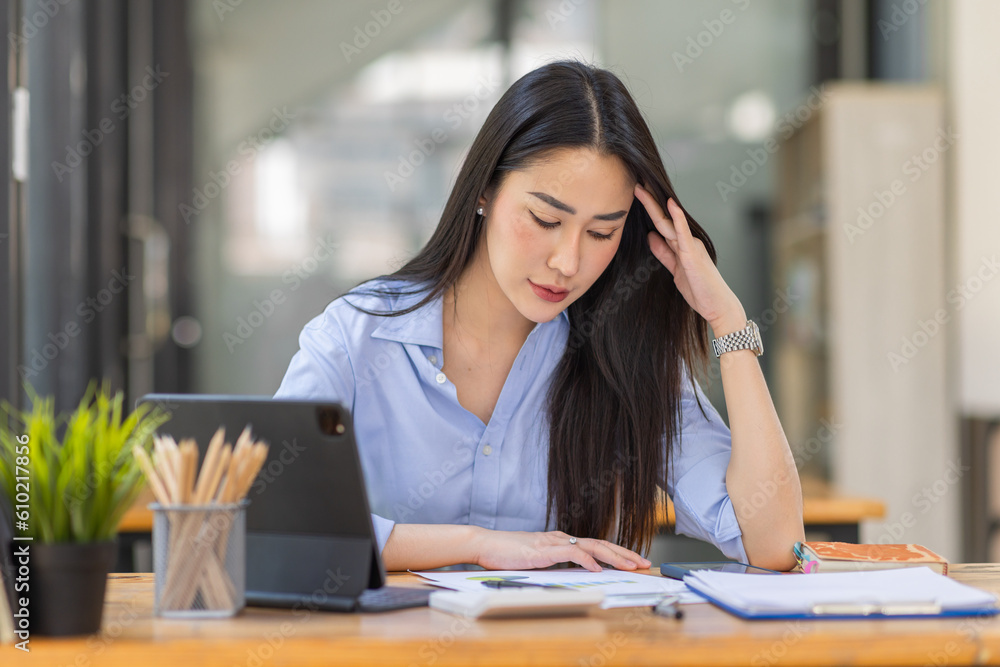 Portrait of tired young business Asian woman work with documents tax laptop computer in office. Sad, unhappy, Worried, Depression, or employee life stress concept
Portrait of tired young business Asian woman work with documents tax laptop computer in office. Sad, unhappy, Worried, Depression, or employee life stress concept