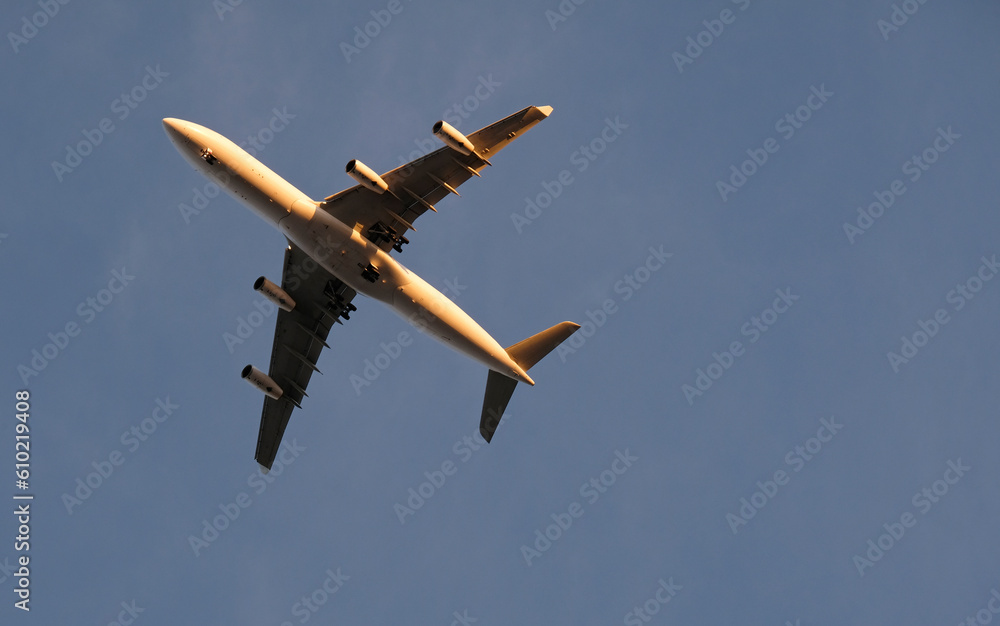 Approaching plane against a clear sky in the evening hours in Lisbon, Portugal Approaching plane against a clear sky in the evening hours in Lisbon, Portugal