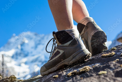 Hiking boots closeup on mountain rocks in Himalayas