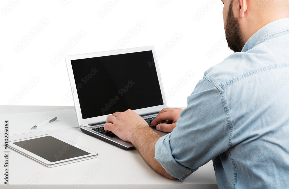 Man using new laptop with touchbar lying on table Man using new laptop with touchbar lying on table