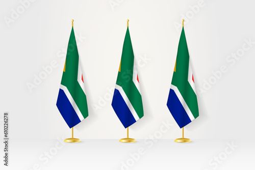 Three South Africa flags in a row on a golden stand, illustration of press conference and other meetings.