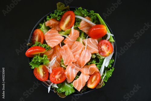 fresh raw salmon fish cooking food seafood salmon fish healthy food black background, salmon salad food salmon fillet with vegetable lettuce leaf tomato herb and spices