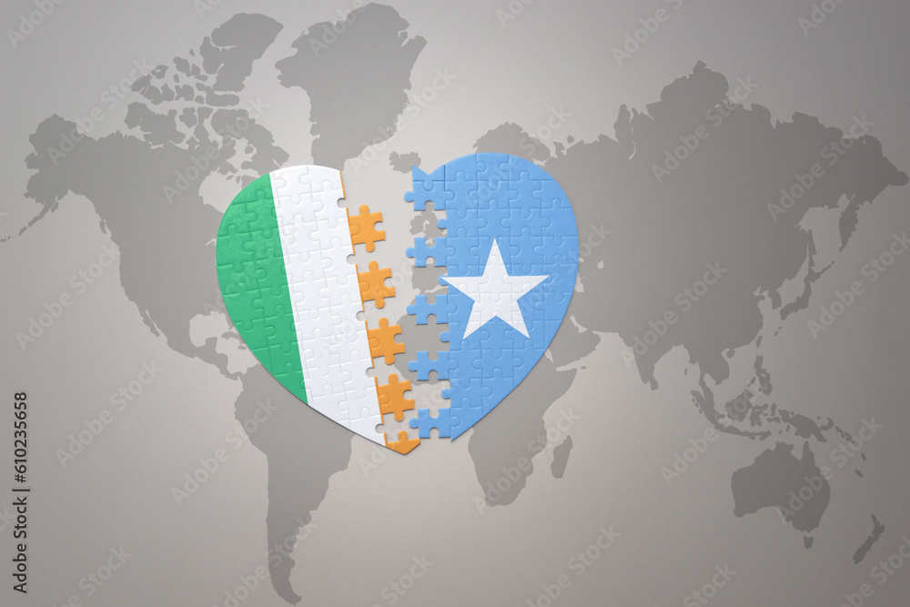 puzzle heart with the national flag of somalia and ireland on a world ...