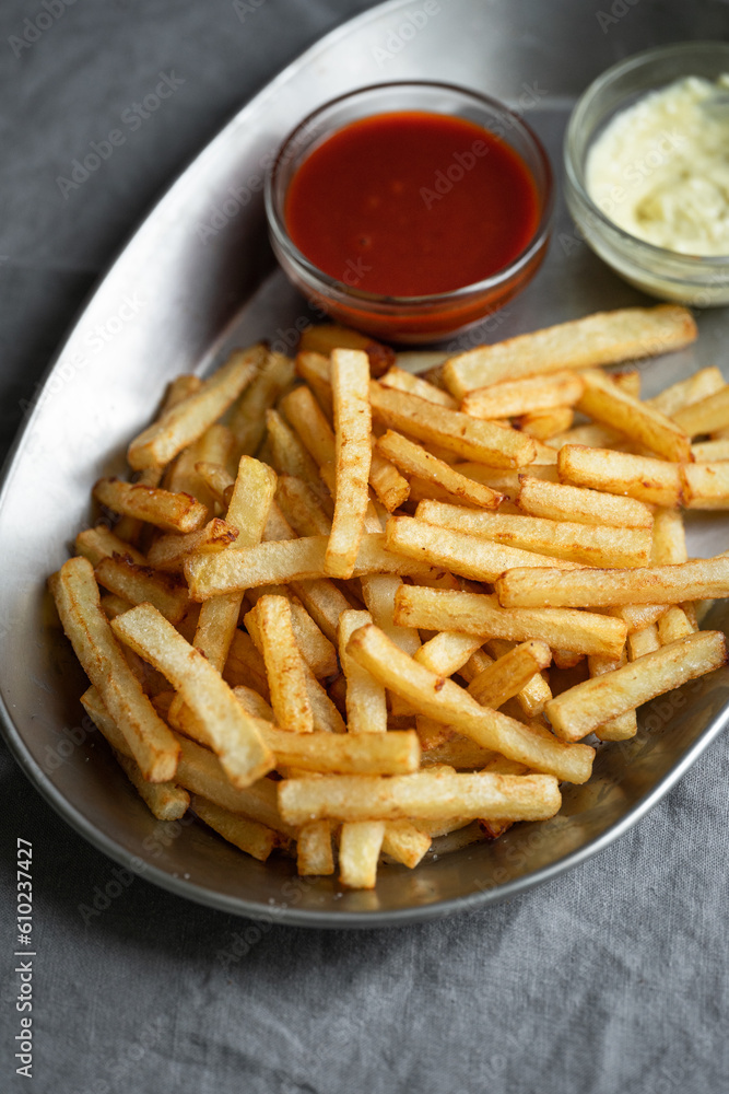 French fries in a tray with sauces French fries in a tray with sauces