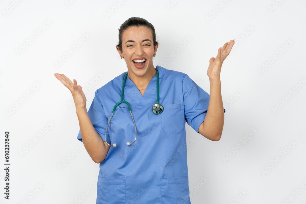 Crazy outraged Young doctor woman wearing blue uniform over isolated background screams loudly and gestures angrily yells furiously. Negative human emotions feelings concept Crazy outraged Young doctor woman wearing blue uniform over isolated background screams loudly and gestures angrily yells furiously. Negative human emotions feelings concept