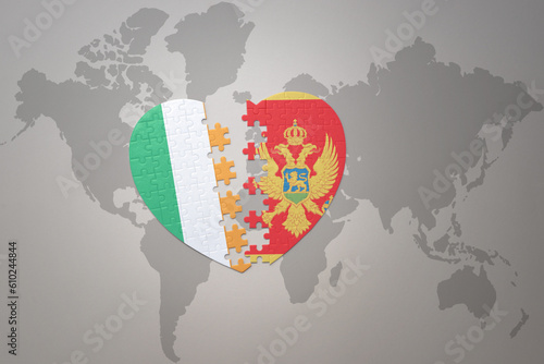 puzzle heart with the national flag of montenegro and ireland on a world map background.Concept.