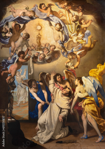 NAPLES, ITALY - APRIL 23, 2023: The painting of Eucharistic vision of St. Thomas Aquinas  in the church Basilica di Santa Maria della Sanita by  Giovan Francesco De Rosa (1607 – 1656). photo